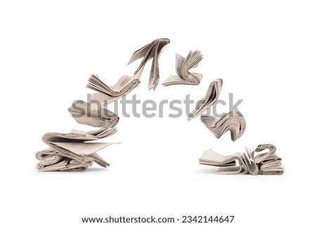 composition from flying newspapers on white background Royalty-Free Stock Photo #2342144647