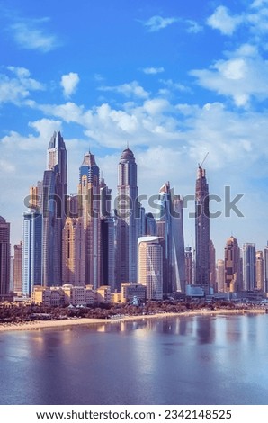 View of the skyscrapers of Dubai Marina from boats and yachts overlooking the waters of the Persian Gulf. Dubai, UAE. High quality photo