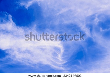The photo features Cumulus humilis clouds, low-level, flat-based, puffy clouds. Form on sunny days, indicating stable atmospheric conditions. Valuable for meteorology and weather forecasting. Royalty-Free Stock Photo #2342149603