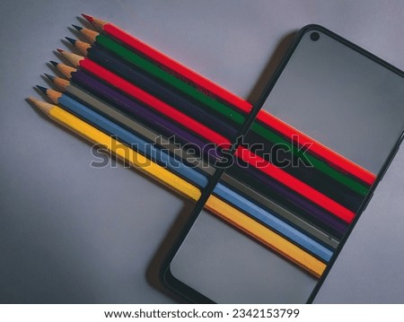 a illusion picture of pencils through mobile phone