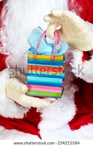Hands of Christmas  Santa Claus with gift