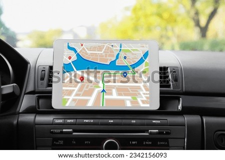 Tablet computer used for navigation in modern car Royalty-Free Stock Photo #2342156093