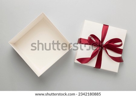 Open gift box on color background, top view. Mock up for design Royalty-Free Stock Photo #2342180885