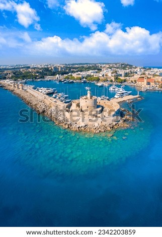 Mandraki port with fort of St. Nicholas and windmills, Rhodes, Greece.  Royalty-Free Stock Photo #2342203859