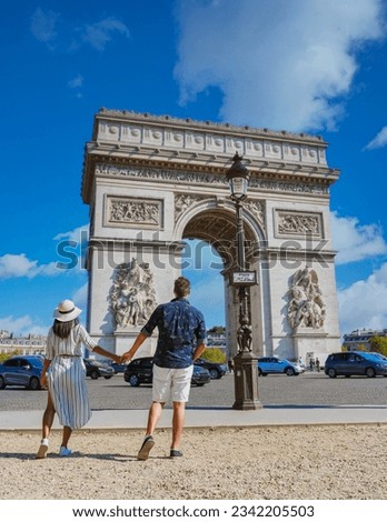 Couple on a citytrip in Paris visiting Avenue des Champs Elysees Paris France Arc De Triomphe. Men and women visiting Arc de Triomphe in Paris during summer Royalty-Free Stock Photo #2342205503