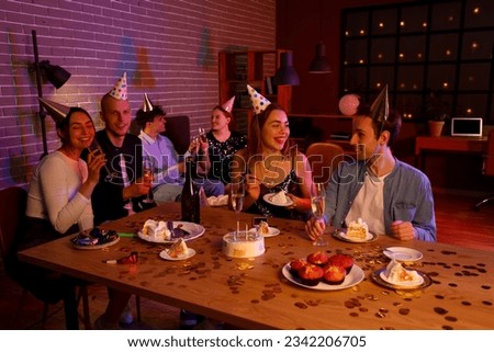 Group of young friends celebrating Birthday at night