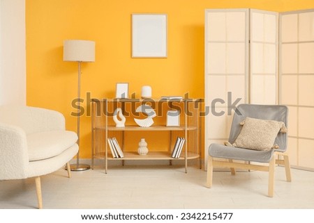Interior of stylish living room with bookshelf and lamp