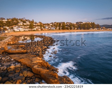 Aerial sunrise sea and shore at Avoca Beach on the Central Coast, NSW, Australia. Royalty-Free Stock Photo #2342221819