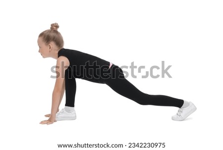 Little girl doing morning exercise on white background