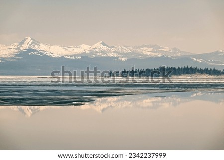 Frozen Elegance Meets Spring's Embrace at Yellowstone Lake