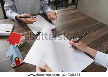 Client negotiate with real estate agents about renting or buying a home client signing a real estate contract in the office