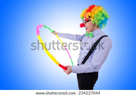 Funny clown with hula hoop on white