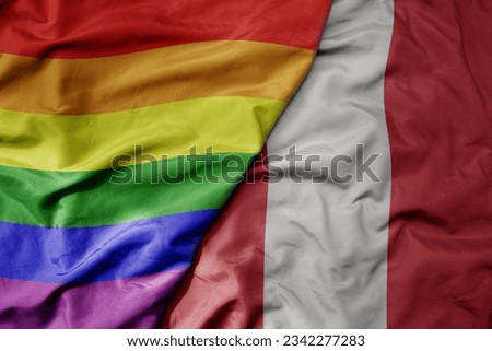 big waving realistic national colorful flag of peru and rainbow gay pride flag . macro