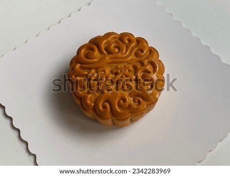 traditional gourmet home made baked moon cake mixed nuts lotus paste egg yolk red bean filling on white background for Chinese mid autumn festival celebration dessert pastry menu halal food in asian