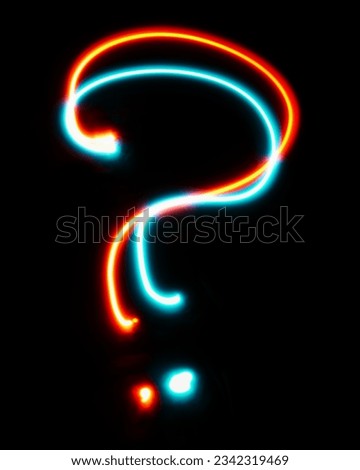 Question mark made from neon sign. The blue red light image, long exposure with colored fairy lights, against a black background. Concept of design