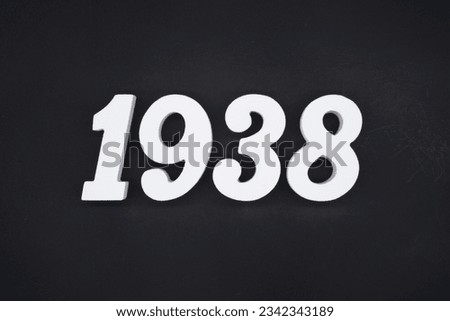 Black for the background. The number 1938 is made of white painted wood.