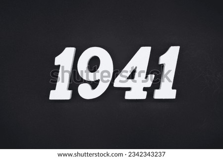 Black for the background. The number 1941 is made of white painted wood.