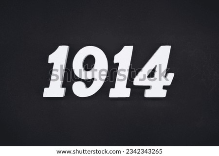 Black for the background. The number 1914 is made of white painted wood.