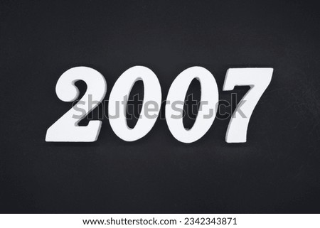 Black for the background. The number 2007 is made of white painted wood.