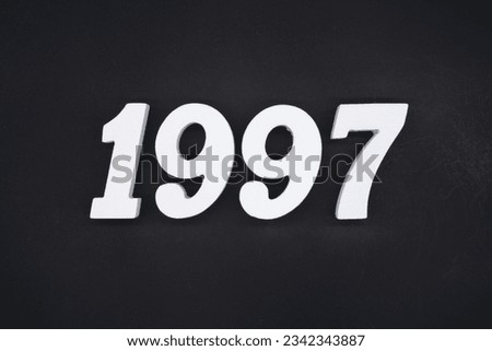 Black for the background. The number 1997 is made of white painted wood.