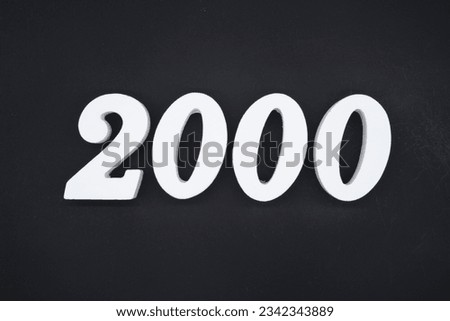 Black for the background. The number 2000 is made of white painted wood.