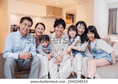 Smiling three-generation family group photo