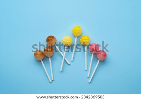 Colorful sweet lollipops. Color lollipop. bright cool candy. copy space. ball lollipops. Round candies on stick. Yummy Lollipops background. Royalty-Free Stock Photo #2342369503