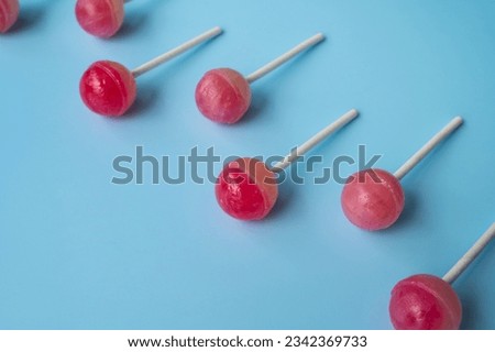 Colorful sweet lollipops. Color lollipop. bright cool candy. copy space. ball lollipops. Round candies on stick. Yummy Lollipops background. Royalty-Free Stock Photo #2342369733