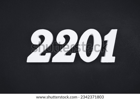 Black for the background. The number 2201 is made of white painted wood.
