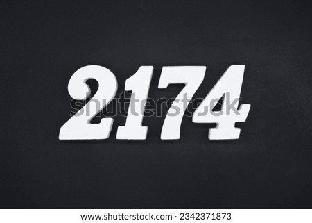 Black for the background. The number 2174 is made of white painted wood.