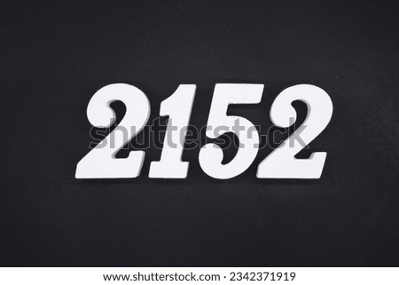 Black for the background. The number 2152 is made of white painted wood.