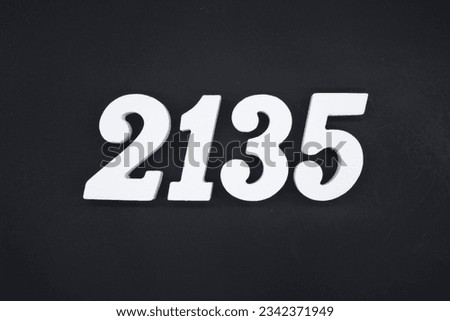 Black for the background. The number 2135 is made of white painted wood.