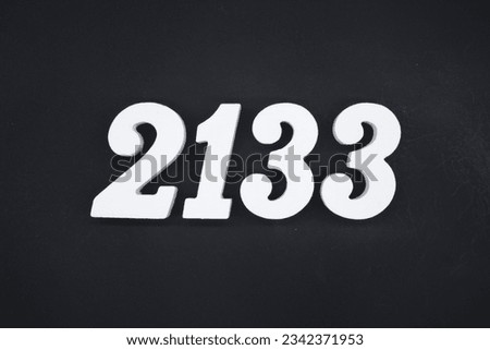 Black for the background. The number 2133 is made of white painted wood.