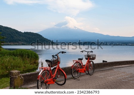 View of Moutain Fuji or Fuji-san from Lake Kawaguchiko with two bicycles in the foreground