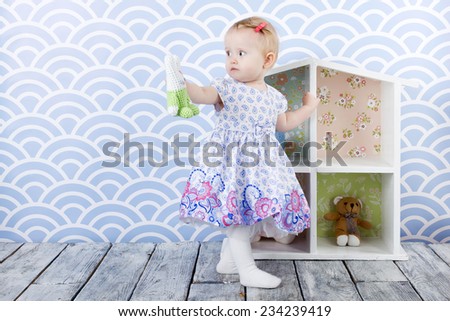 A girl with doll house 