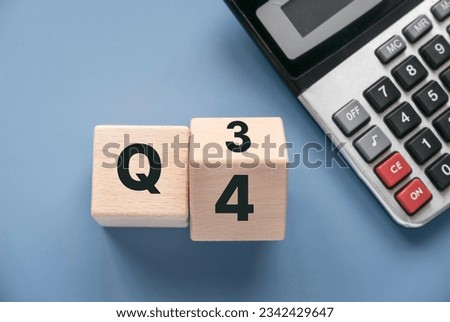 Quarterly report concept.Company financial report.Business charts. Wooden cube represent quarter third and fourth. Royalty-Free Stock Photo #2342429647
