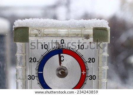 thermometer outdoors snow winter cold snap Royalty-Free Stock Photo #234243859
