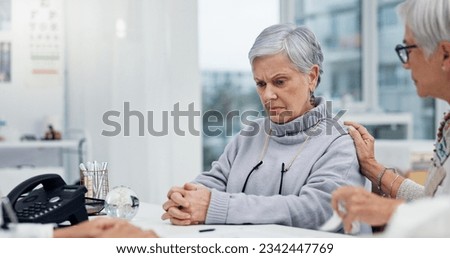 Healthcare, cancer or bad news with a senior woman and friend talking to a doctor in the hospital. Medical, support and diagnosis with a medicine professional consulting a patient in the clinic Royalty-Free Stock Photo #2342447769