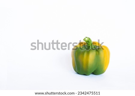 Capsicum annuum on white background. yellow bell pepper on white background. Royalty-Free Stock Photo #2342475511
