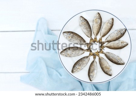 Safi fish, small, Al-Safi (potato) or Al-Sijan - one of the most famous fish of the Persian Gulf. Siganus canaliculatus. Rabbit fish, seafood, top view, free space, place for text, background image
