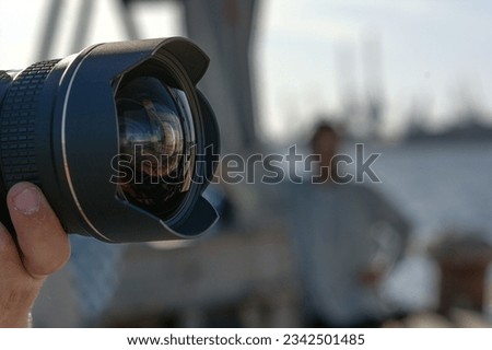 A closeup image of a professional video camera with a wide angle lens Royalty-Free Stock Photo #2342501485