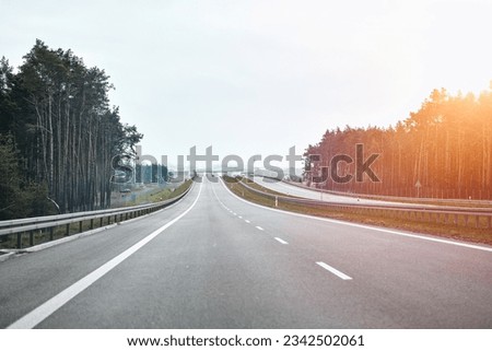 Driving on Poland's A1 Autostrada. The Scenic Amber Highway to Gdansk View from the Car. New A1 highway in Poland. The autostrada A1, officially named Amber Highway. View from the car on a road. Royalty-Free Stock Photo #2342502061