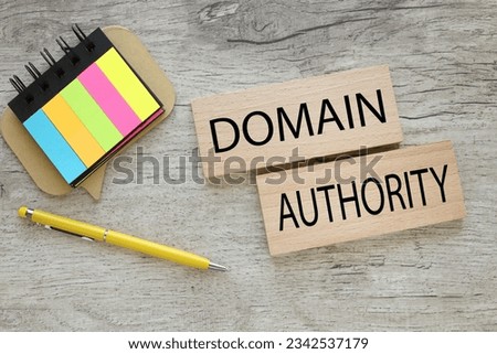 two wooden blocks with text. bright stickers Domain Authority Royalty-Free Stock Photo #2342537179