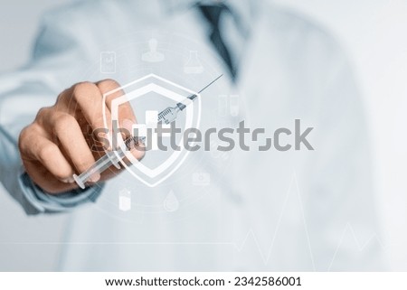 Medical concept. Hand of doctor with syringe with medical icons.