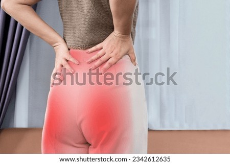 woman suffering from lower back and buttock pain spreading to down leg, Sciatica Pain concept 
