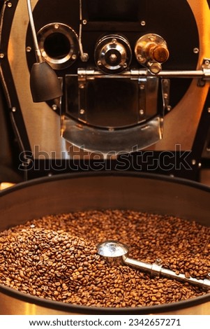 metal oven for roasting coffee beans. iron mixer for mixing coffee raw materials during roasting. preparing coffee for grinding and drinking