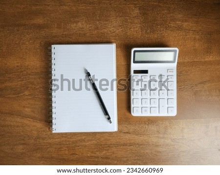 Calculator and business organizer, notebook or planner with pencil