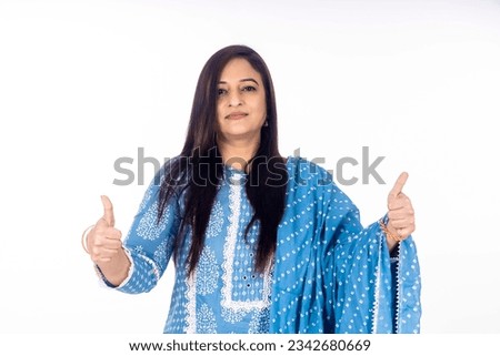 Indian woman showing thumbs up on white background.