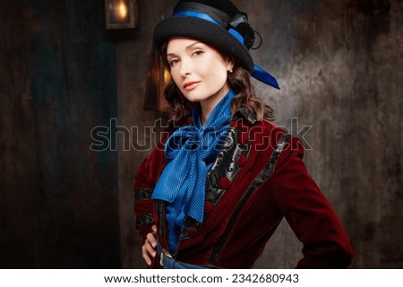 A stylish lady in a burgundy old - fashioned suit with a hat . Brunette in a retro style suit Royalty-Free Stock Photo #2342680943