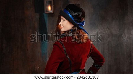 A stylish lady in a burgundy old - fashioned suit with a hat . Brunette in a retro style suit Royalty-Free Stock Photo #2342681109
